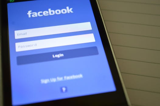 Mobile phone with Facebook login screen, highlighting digital connectivity and social media use.